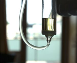 A saline bottle is fixed to the patient